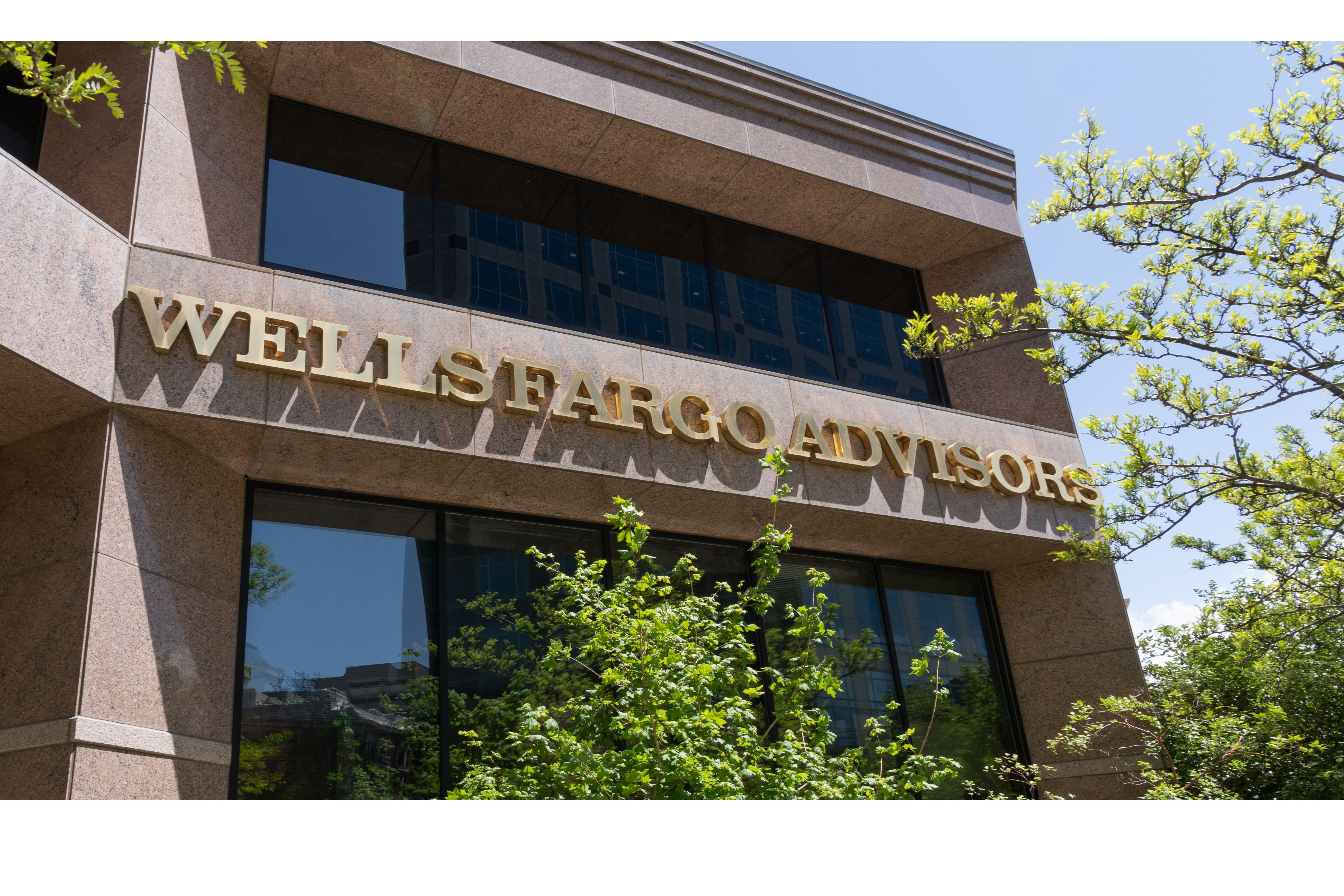 Close up of Wells Fargo Advisors sign on the building in Salt Lake City, UT, USA - May 11, 2023. Wells Fargo Advisors is a subsidiary of Wells Fargo.
